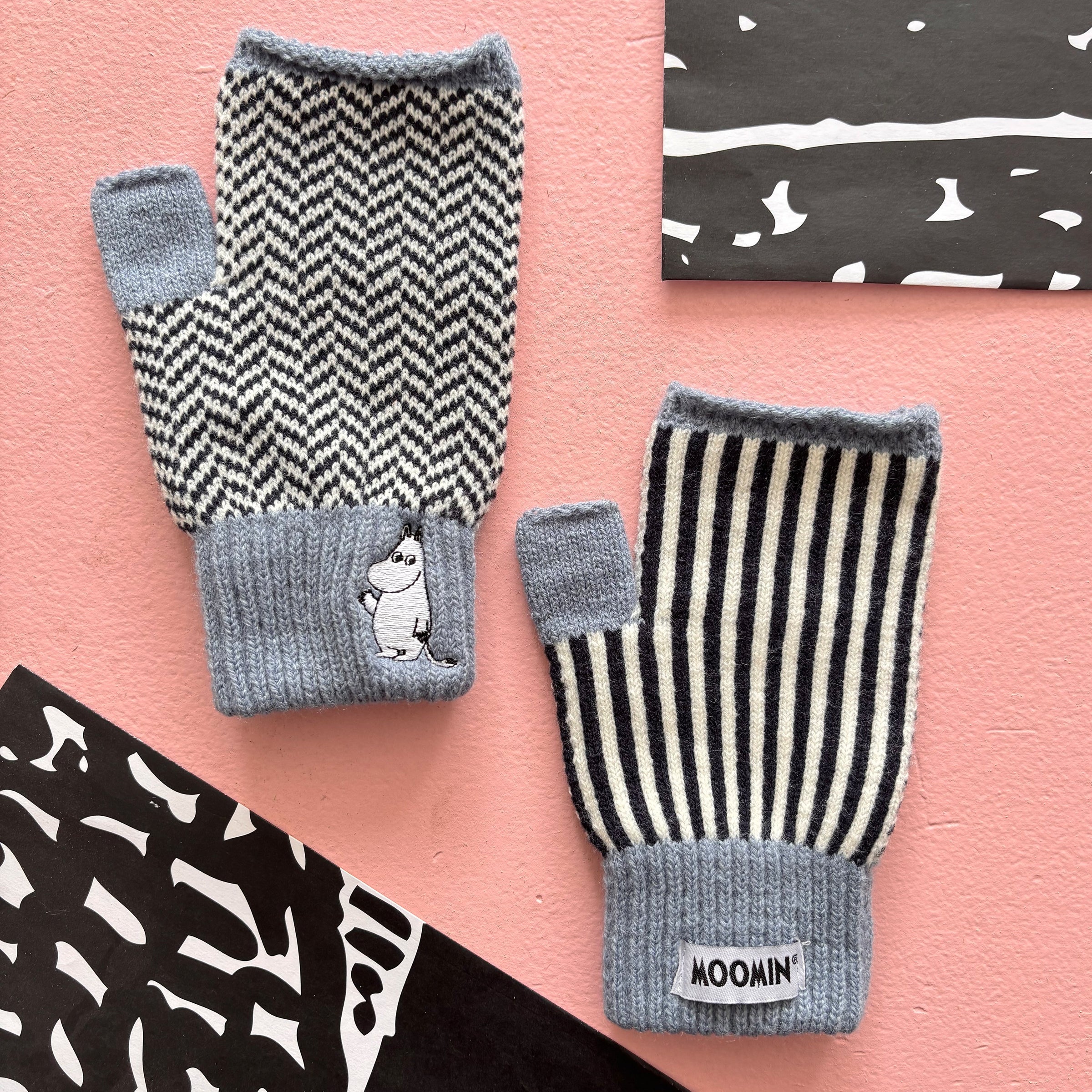 Flat lay of Moomin Herringbone Gloves showing Moomin character embroidery and monochrome design.
