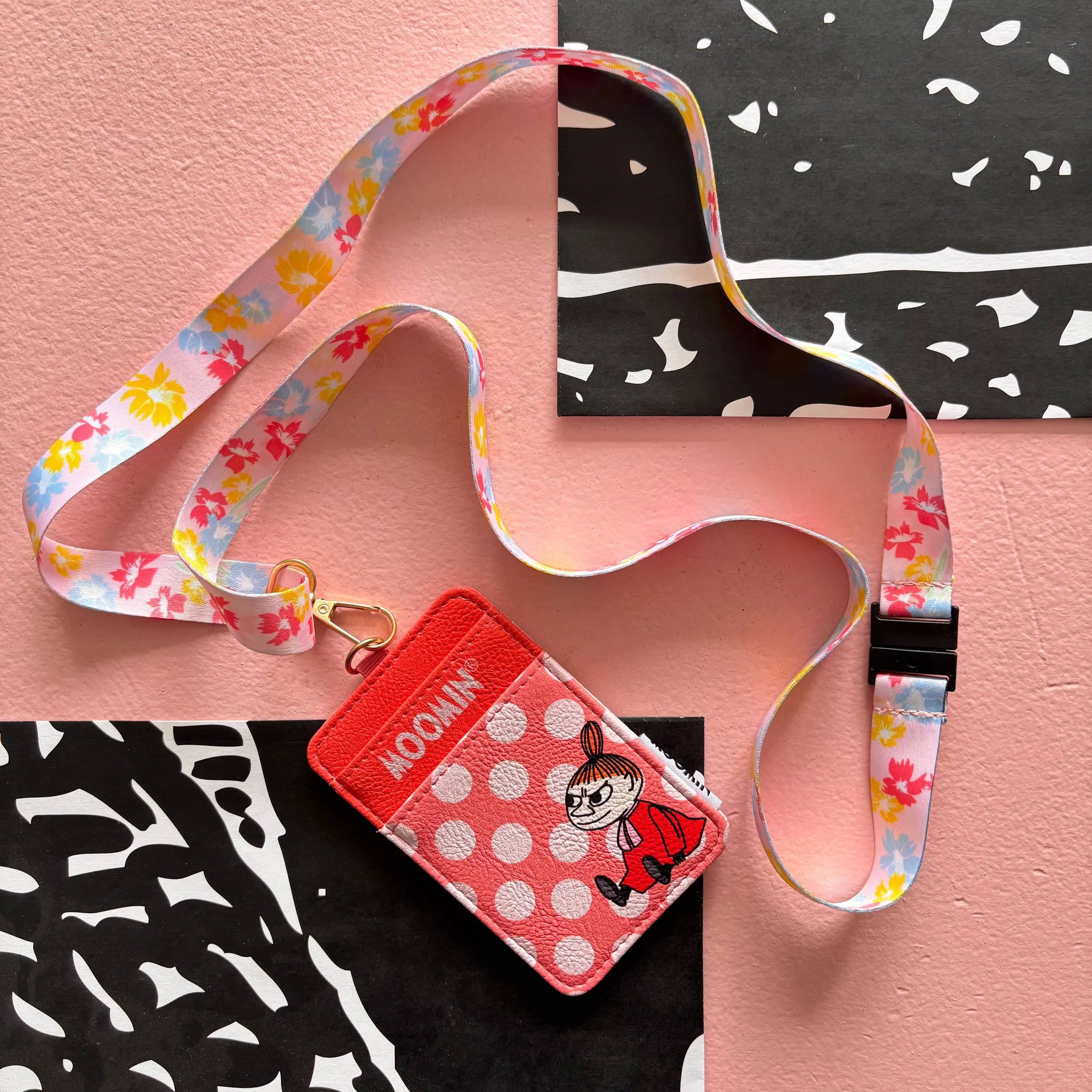 Flat lay of Moomin Little My Lanyard front view showing polka dot design and Little My illustration.
