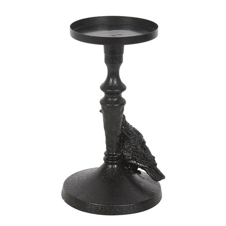 Raven candle holder showing ornate gothic base design