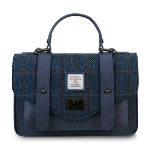 Navy over-check Harris Tweed medium leather satchel front view with top handle.