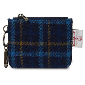 Navy tartan Harris Tweed card zip wallet with zip closure and keyring attachment on white background.
