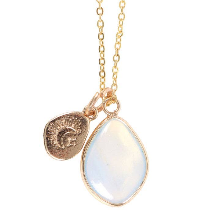 Close-up of Opalite Manifestation Necklace showing gold chain and teardrop opalite pendant with moon and sun charm detail.