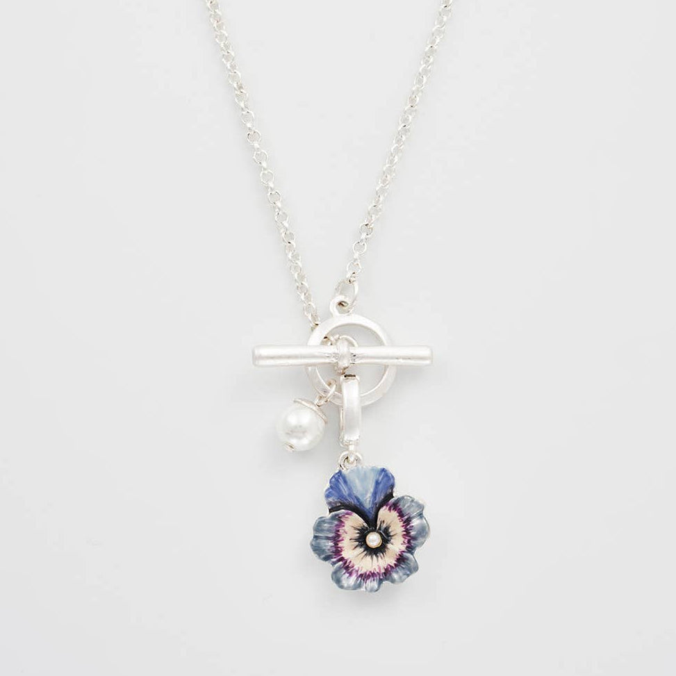 Silver toggle necklace with pansy and pearl charms close-up