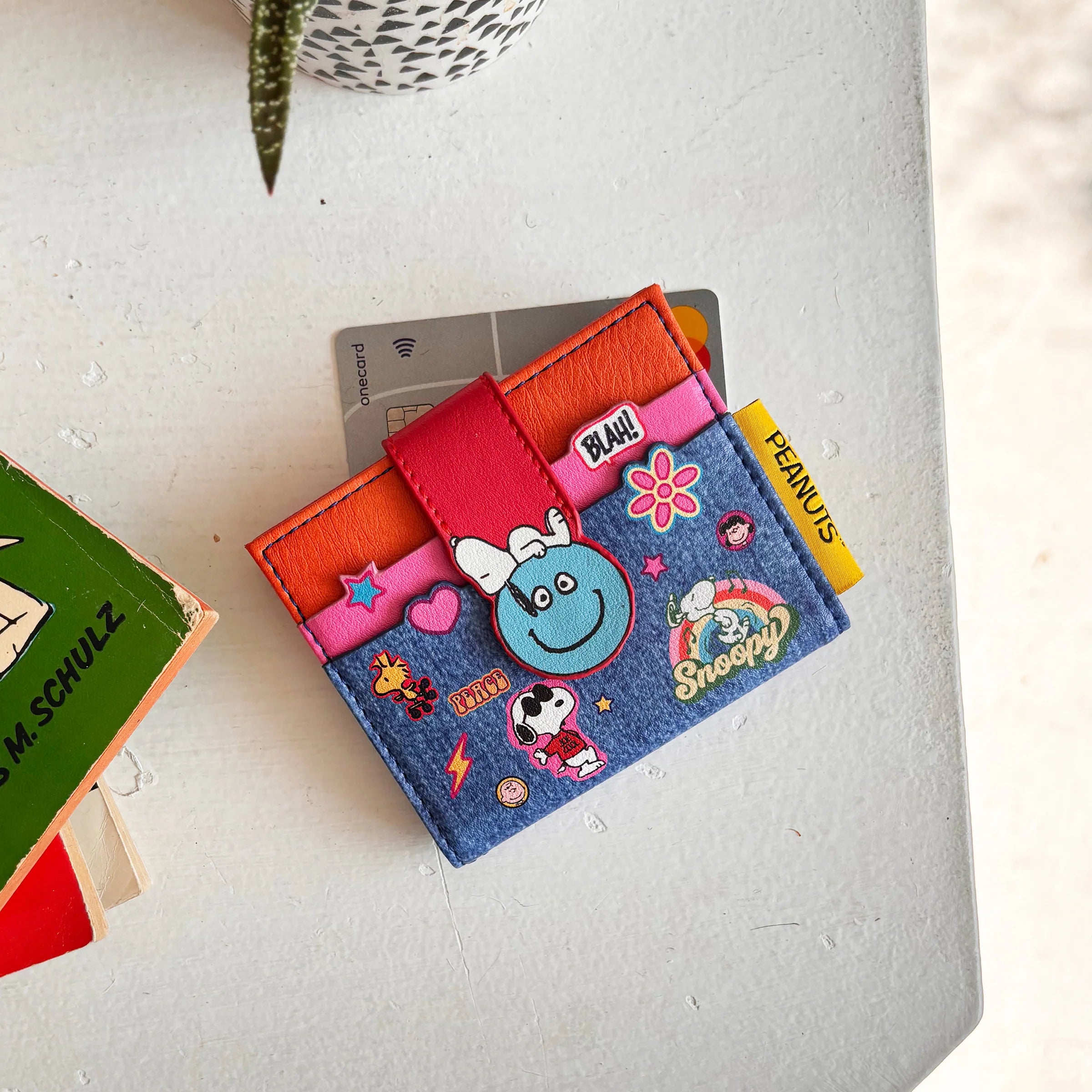 Peanuts foldover wallet showing popper fastening