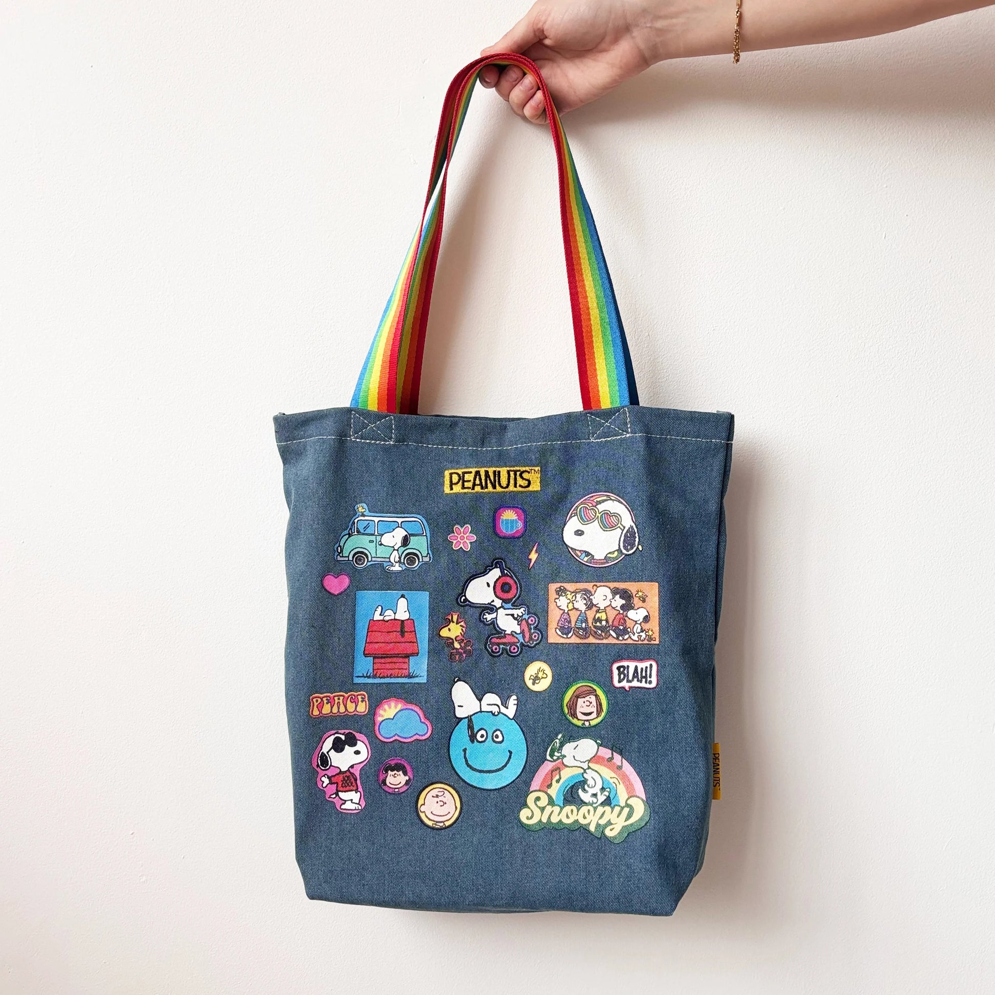 Peanuts denim tote bag with rainbow handles held up
