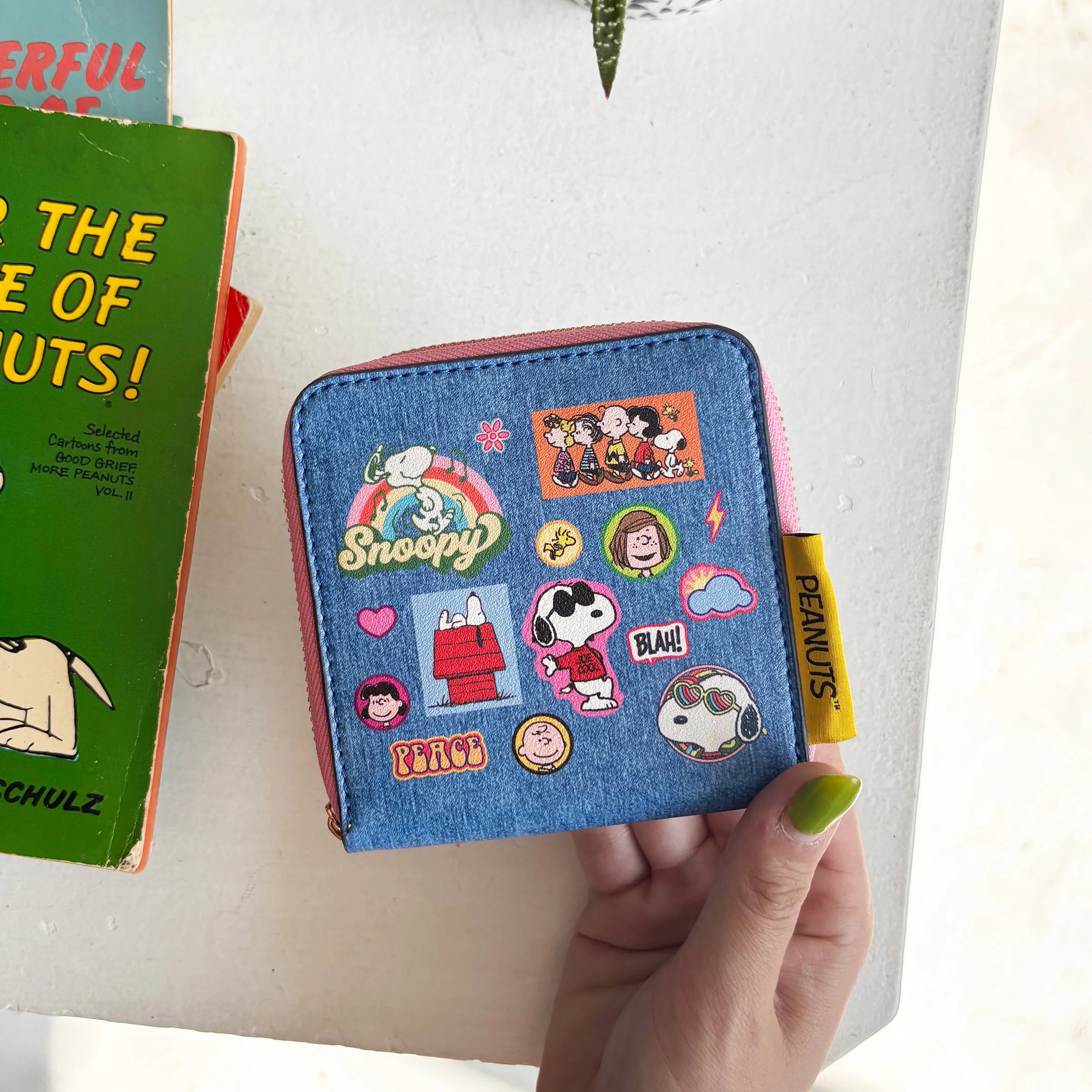 Front view of Peanuts patch purse with retro character prints