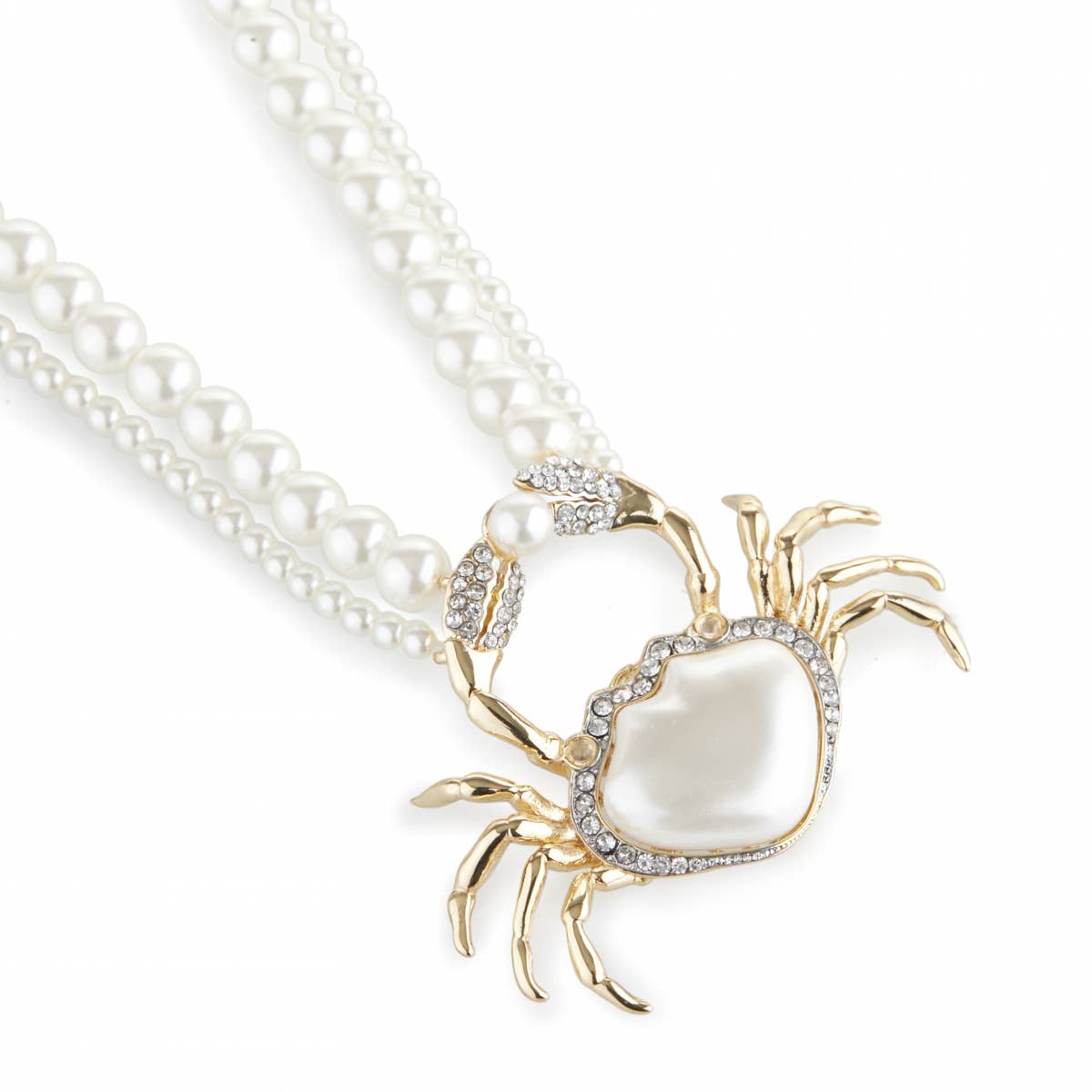 Close-up of Bill Skinner Pearly Crab Necklace showing pearlised crab pendant with gold-plated claws and crystal detailing.