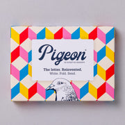 Urban Pigeons pack front with colourful retro 3D cube design on cream background