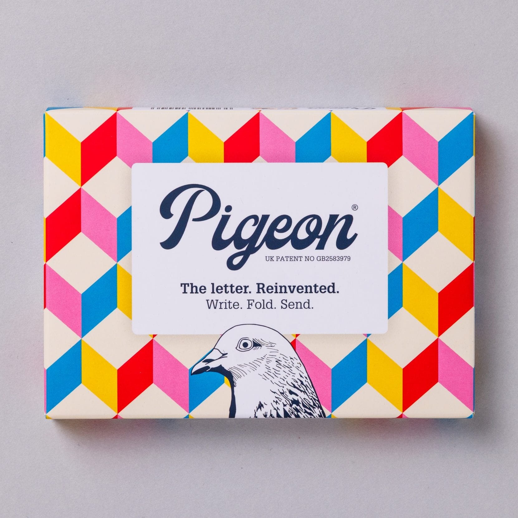 Urban Pigeons pack front with colourful retro 3D cube design on cream background
