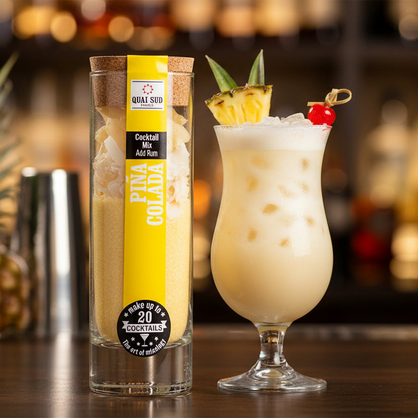 Piña Colada cocktail mix in a clear glass tube with cork lid, showing pineapple and coconut pieces.