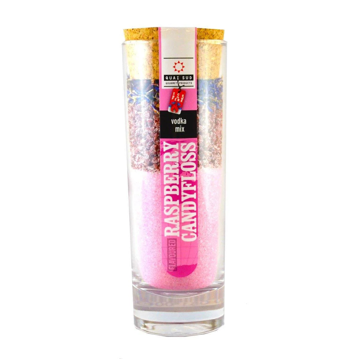Raspberry and candyfloss cocktail mix in a clear glass tube with cork lid and pink layered sugars.