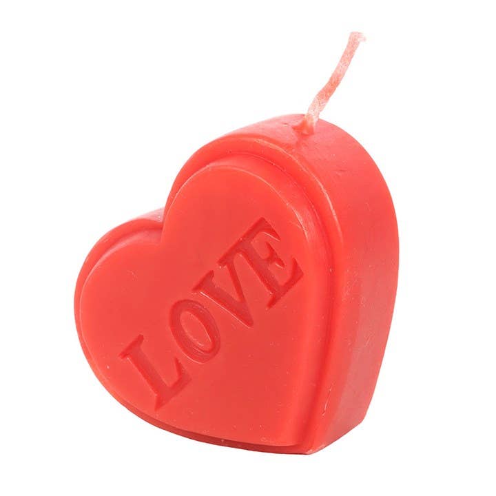 Heart candle showing red wax and wick detail