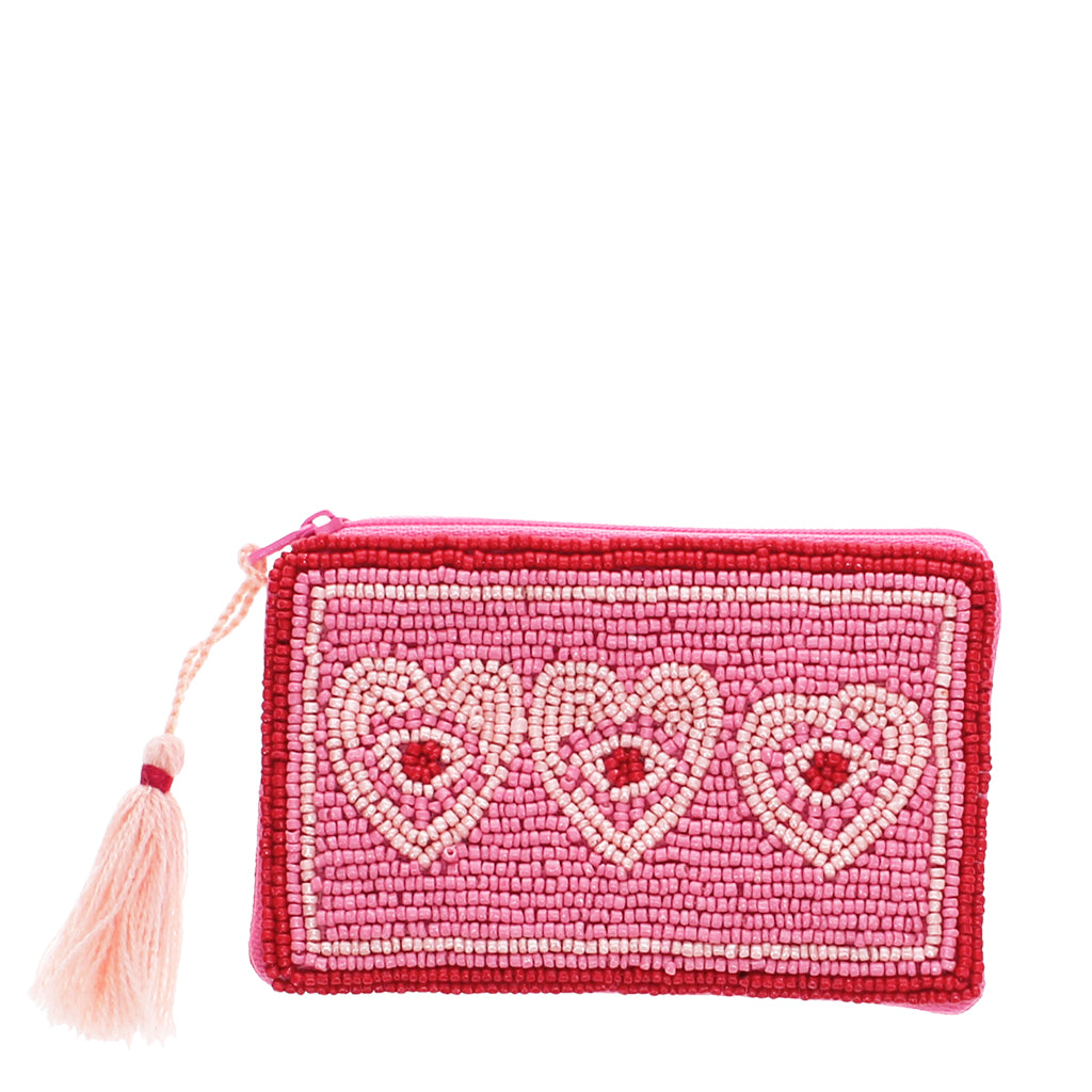 Beaded coin purse with three hearts in pink and red on white background