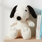 Snoopy ECO corduroy cream soft toy on wooden shelf with books