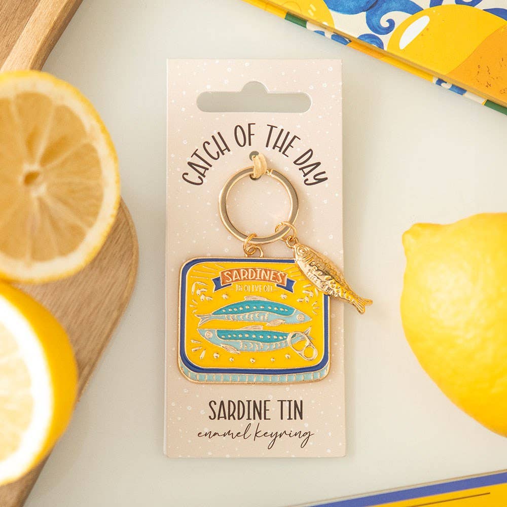 Sardine tin keyring on packaging card with Mediterranean lemon styling