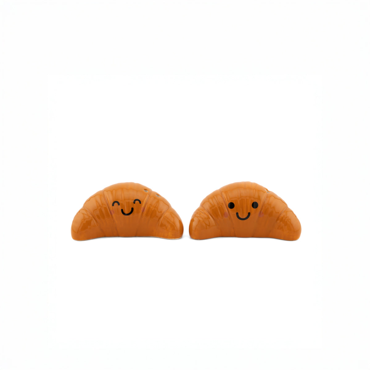 Back view of two ceramic croissant shakers on white background