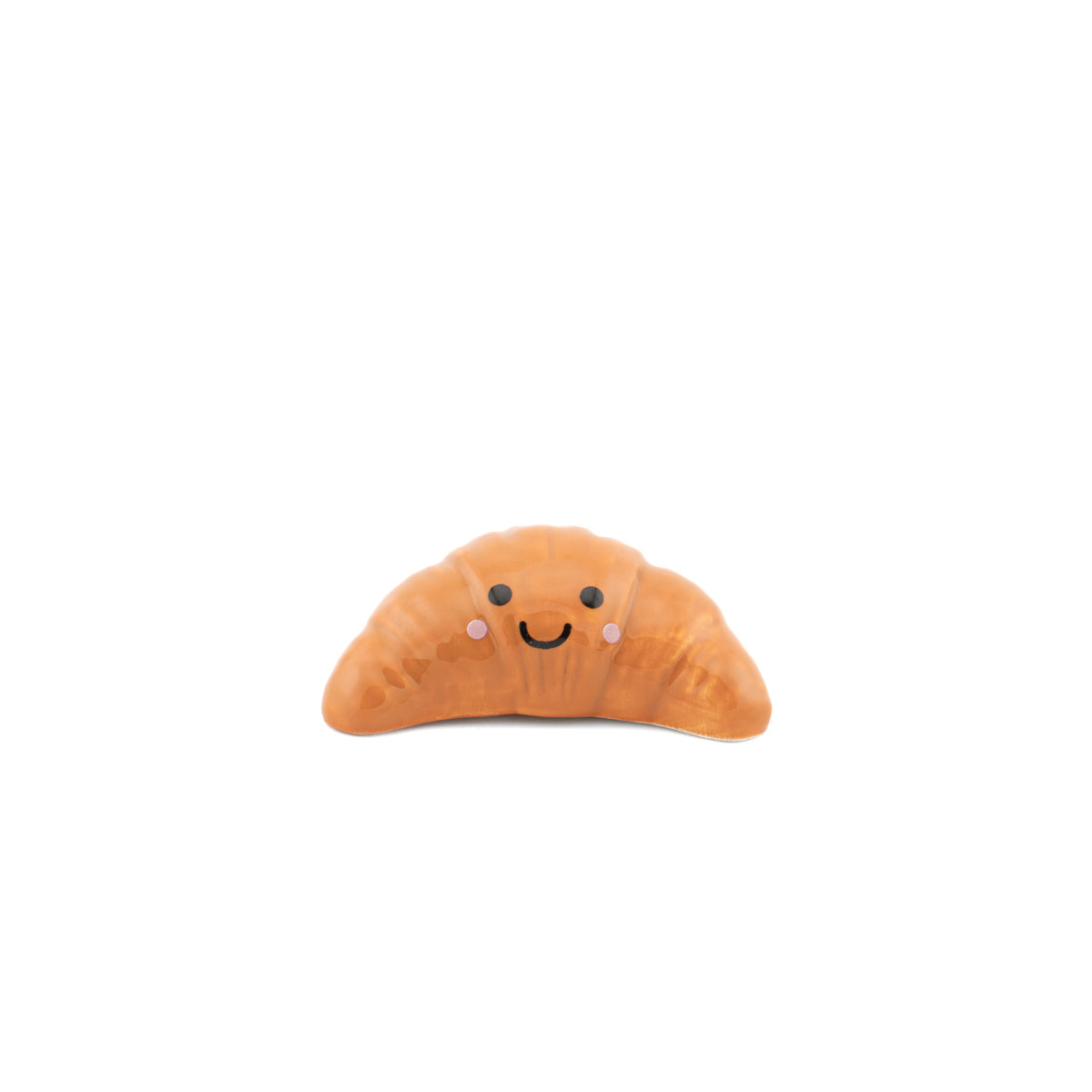 Single croissant token with smiley face on white background front view