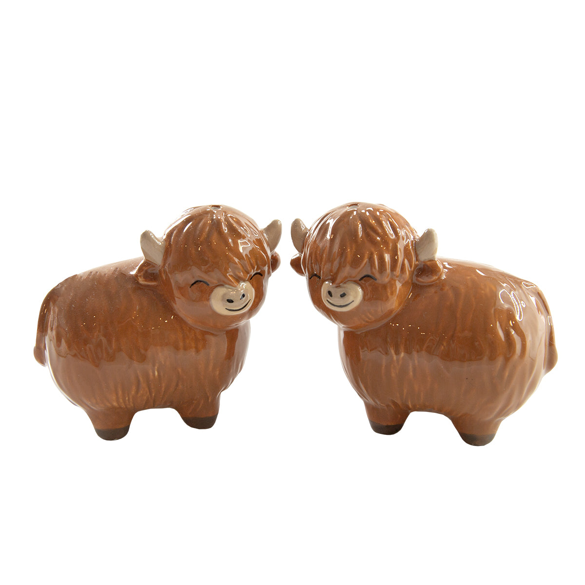 Highland cow salt and pepper shaker pair close-up on white background