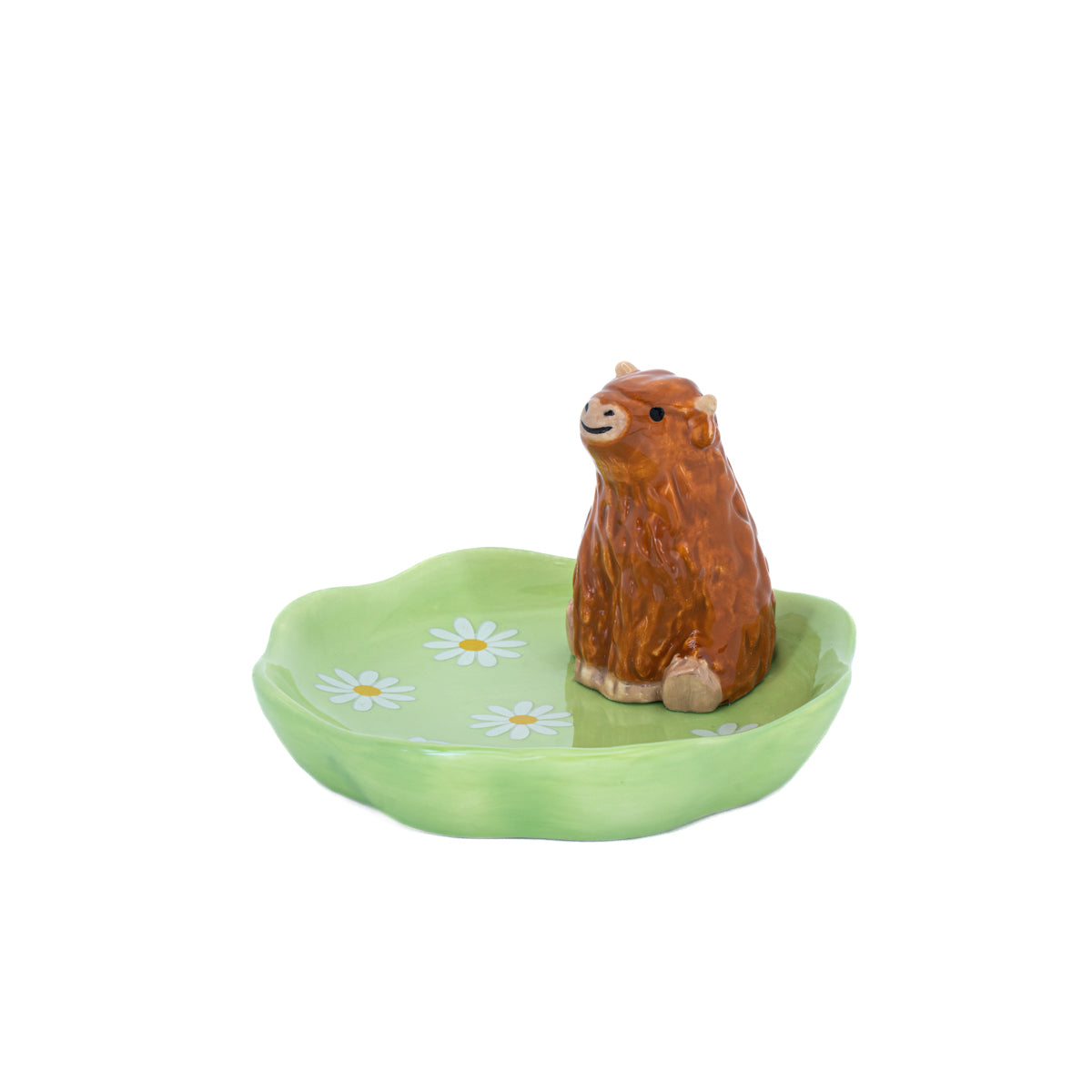 Highland cow ceramic trinket dish with green daisy design on white background