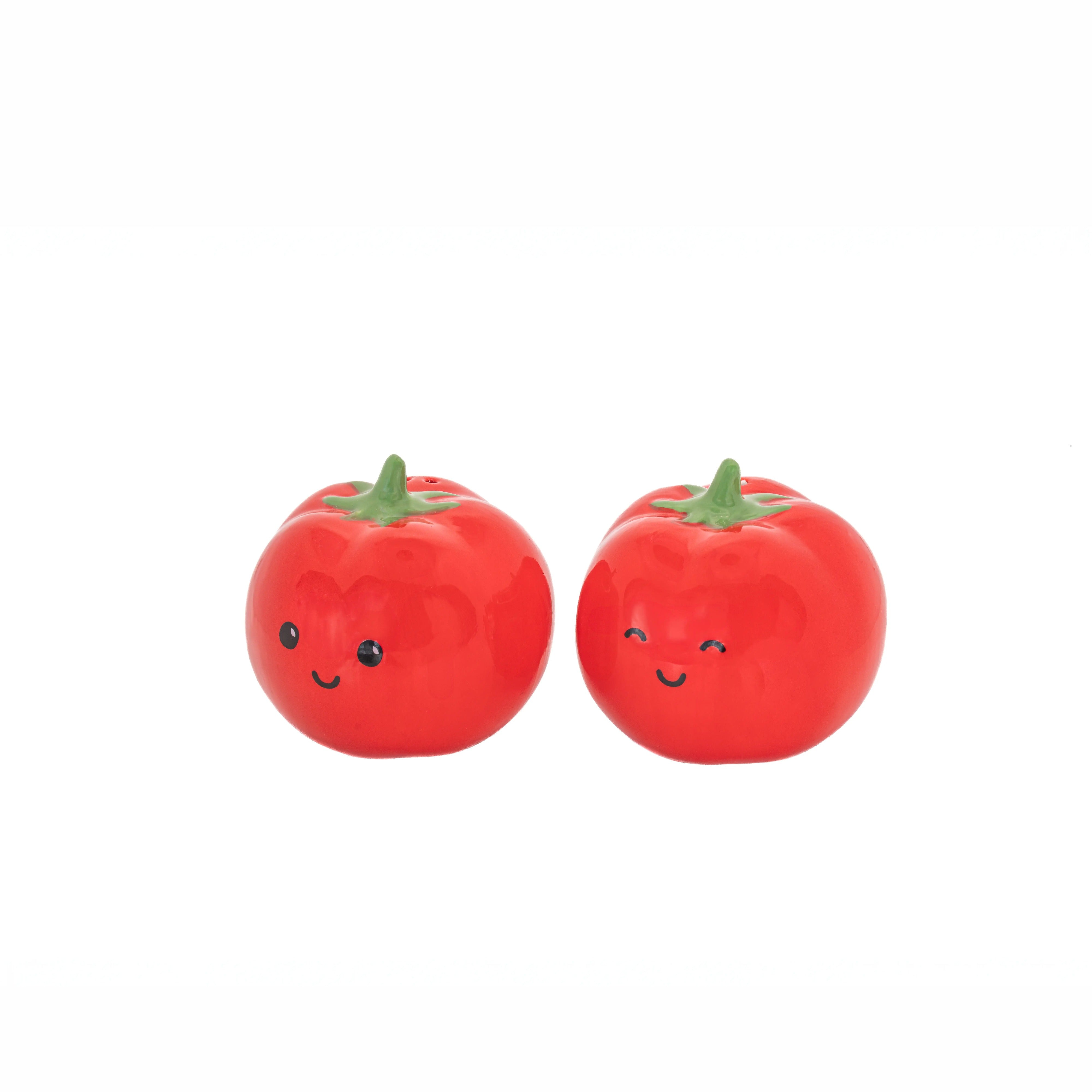Red ceramic tomato salt and pepper shakers pair on white background