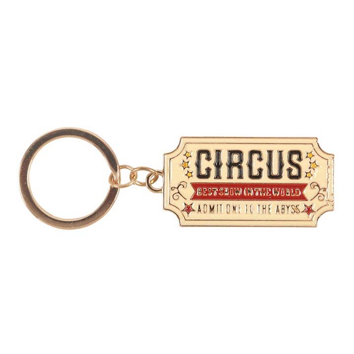 Close-up of circus ticket keyring on white background