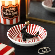 Seal trinket dish with red/white stripes on dark moody background