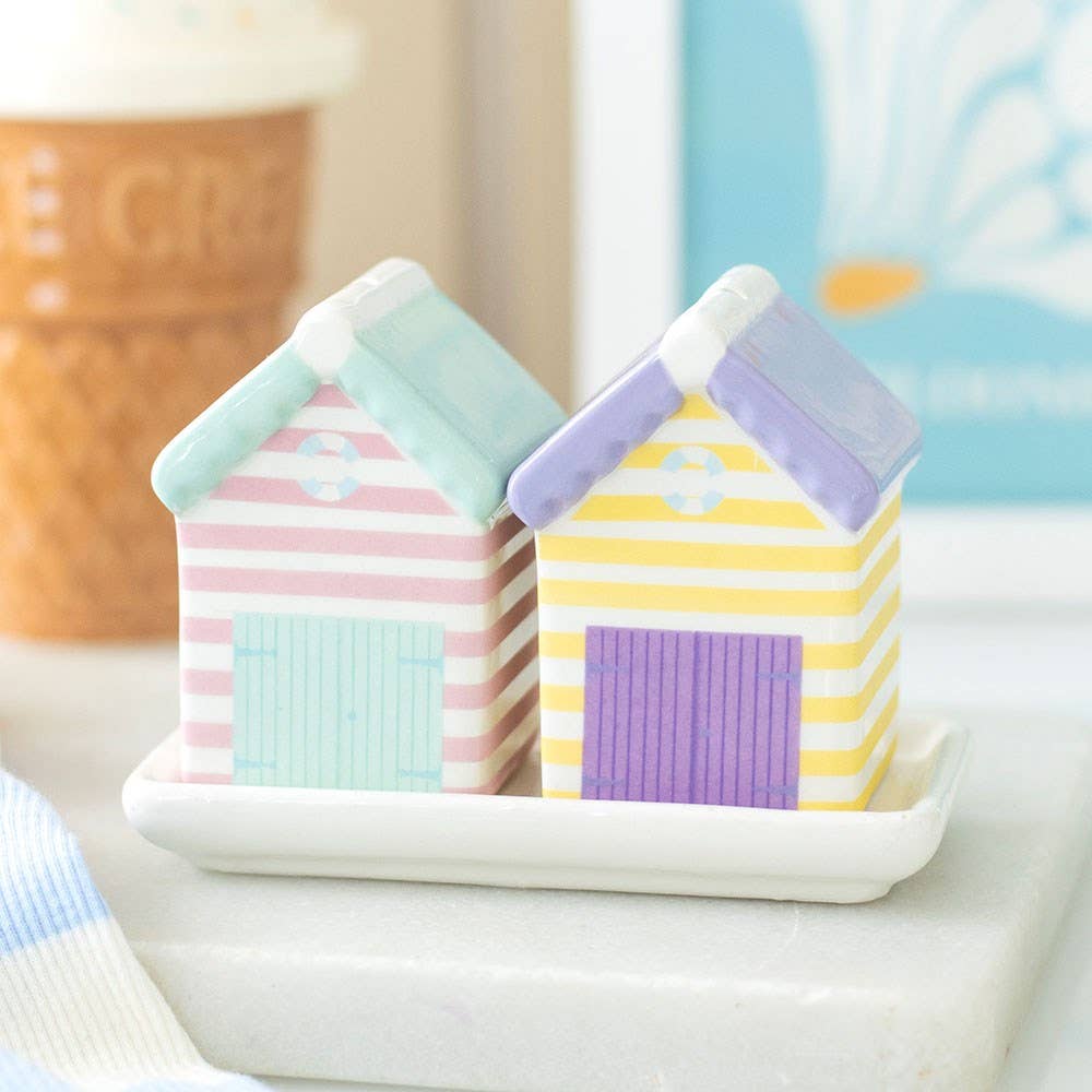 Pastel beach hut salt and pepper shakers on tray styled in coastal setting