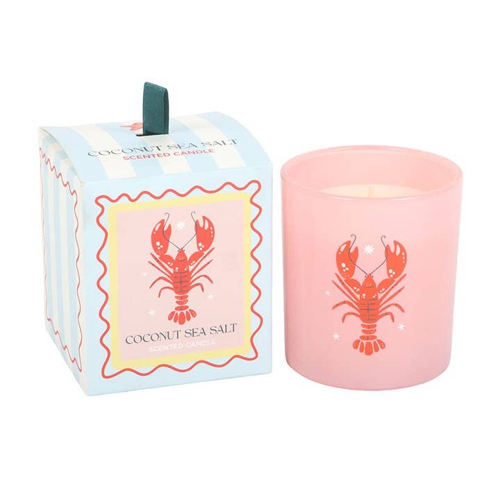 Close-up of lobster design on glass candle against white background