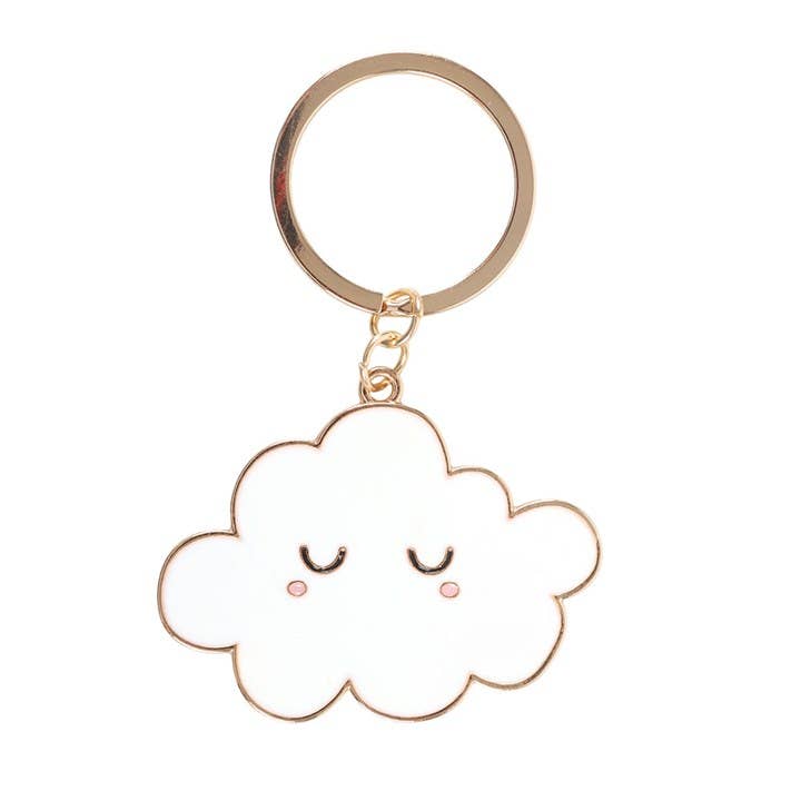 White enamel cloud charm close-up with gold outline and sleepy face
