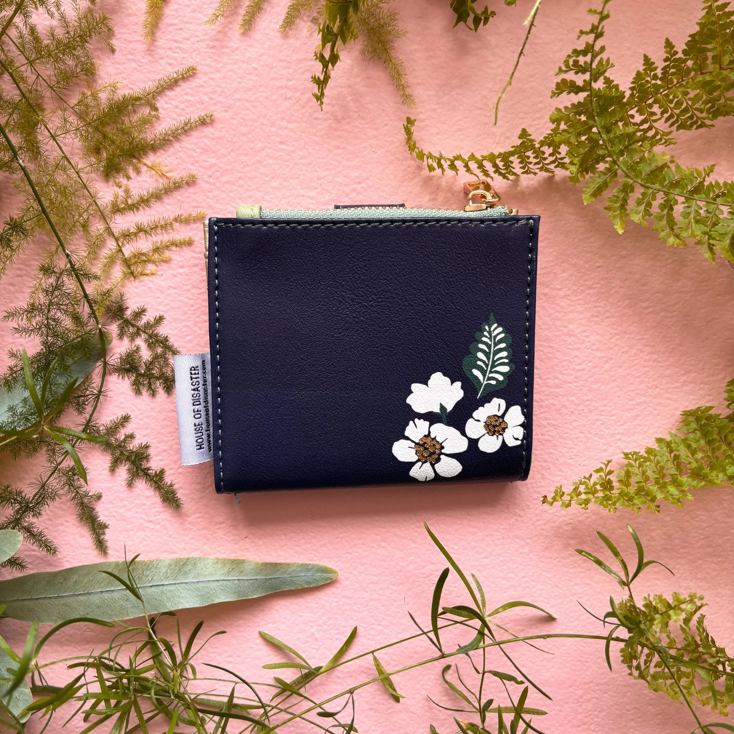 Back view of bird purse with floral illustration