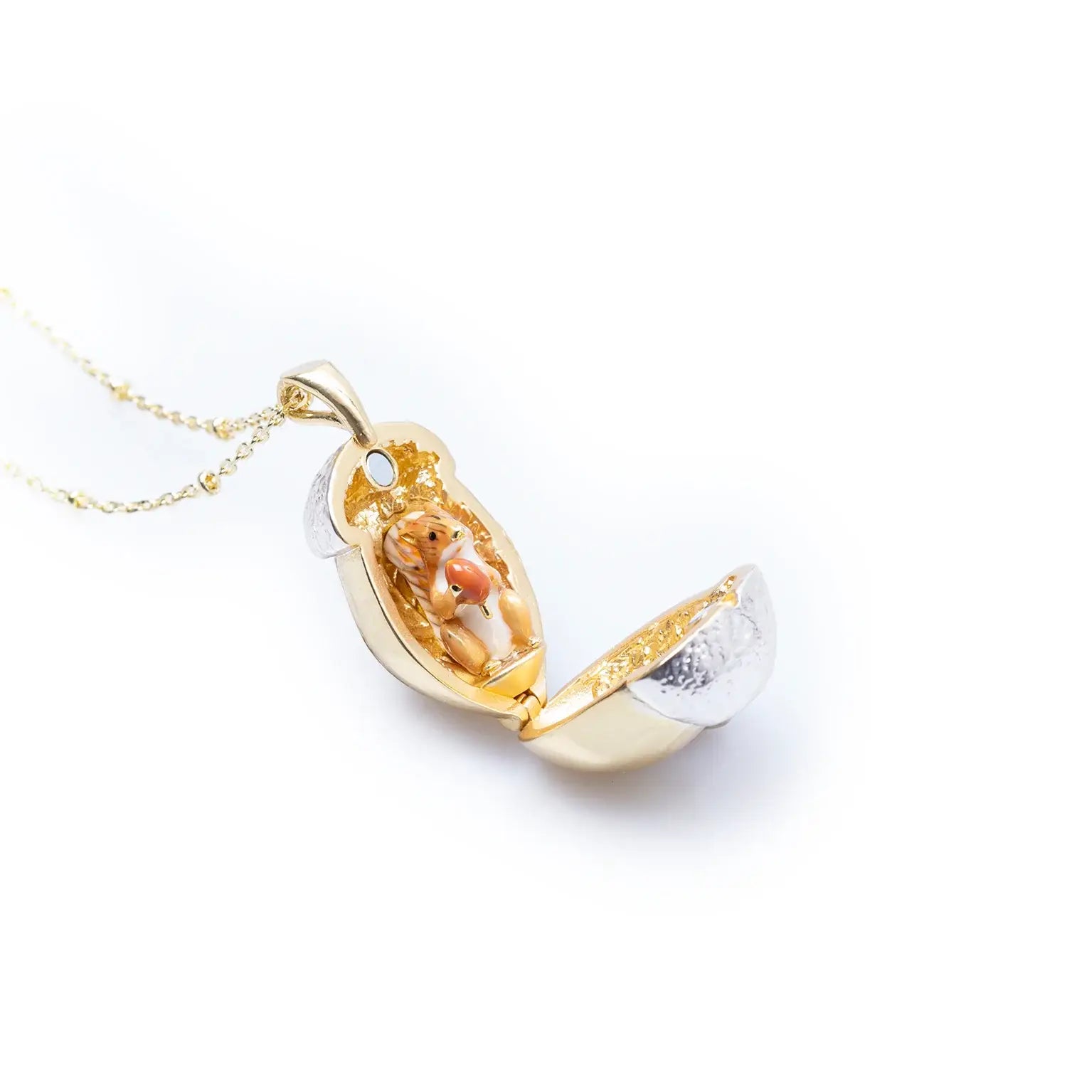 Squirrel Acorn Locket necklace shown open with gold-plated acorn and enamel squirrel detail on white background.