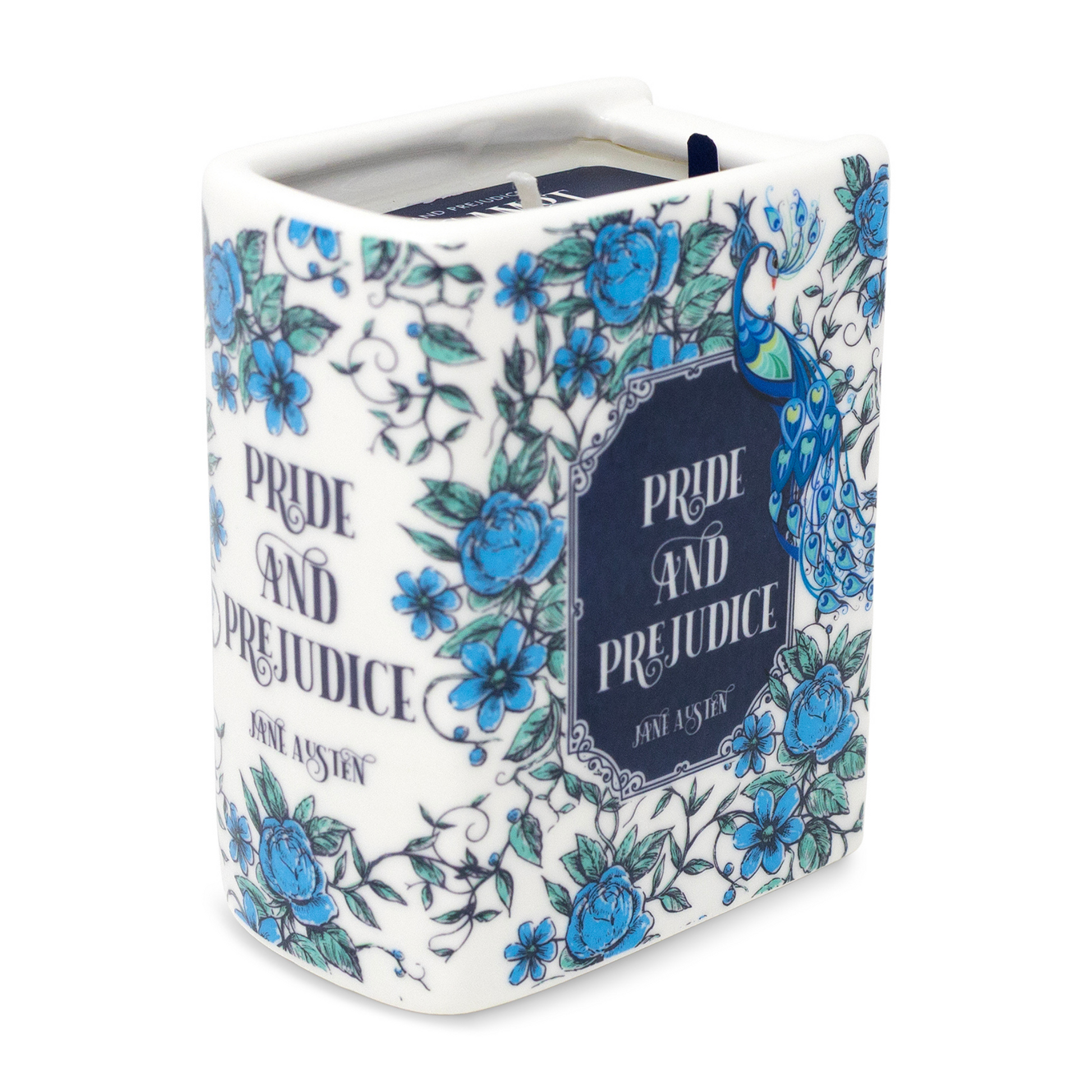 Ceramic book candle showing spine and front cover with blue floral pattern