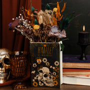 Black Hamlet book vase holding dried flowers