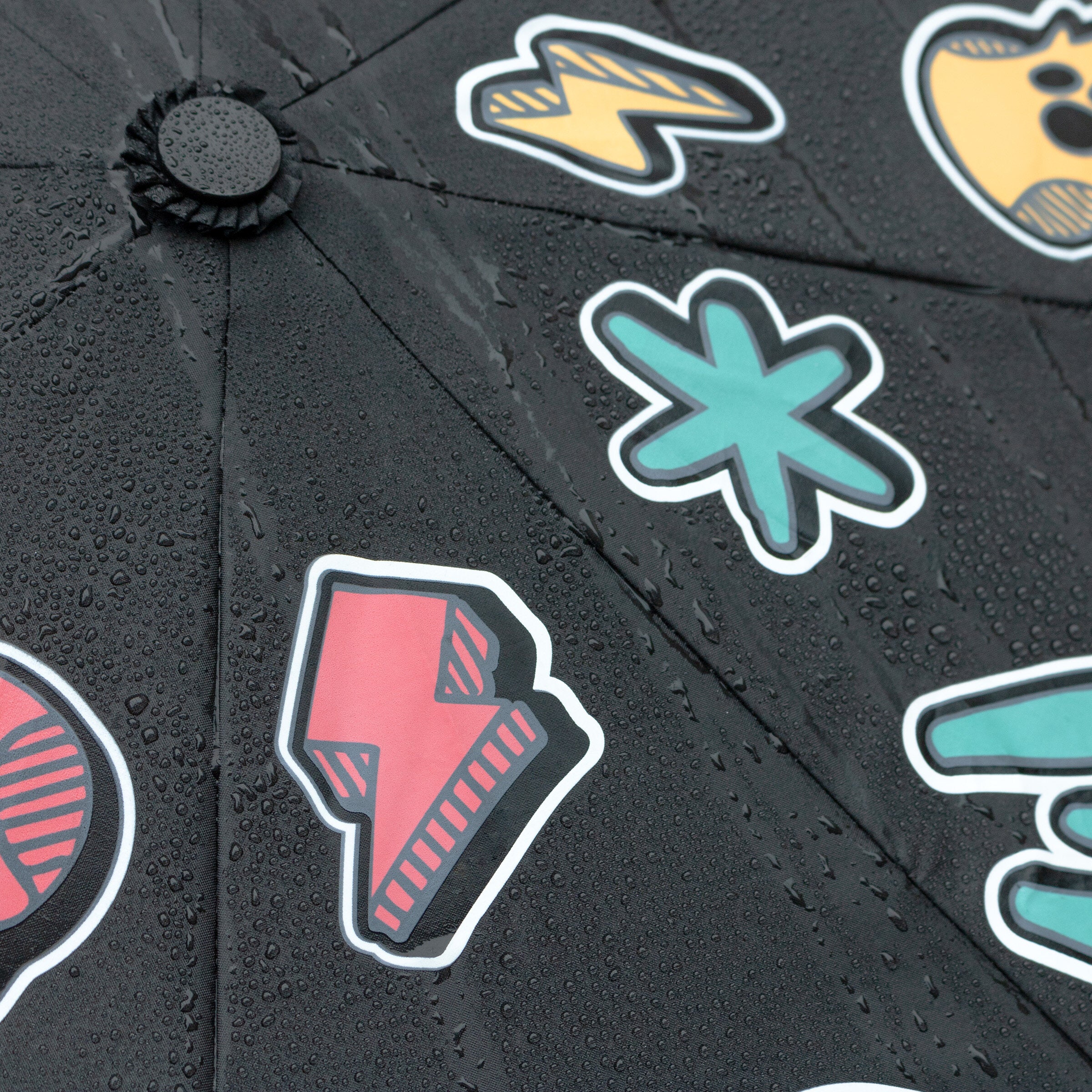 Close-up of weather pattern umbrella wet fabric with colourful icon details