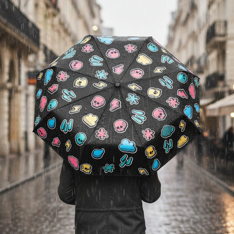 Weather pattern umbrella held in rain showing colourful icons on city street