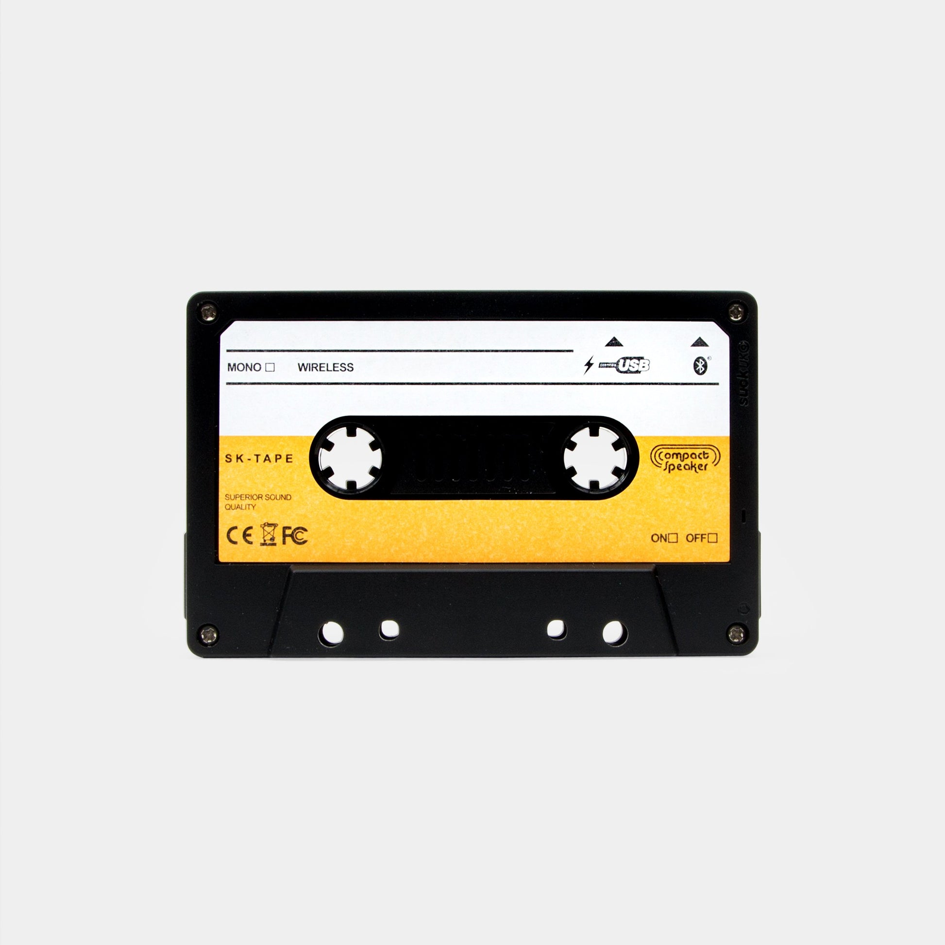 Retro cassette tape Bluetooth speaker front view on grey background