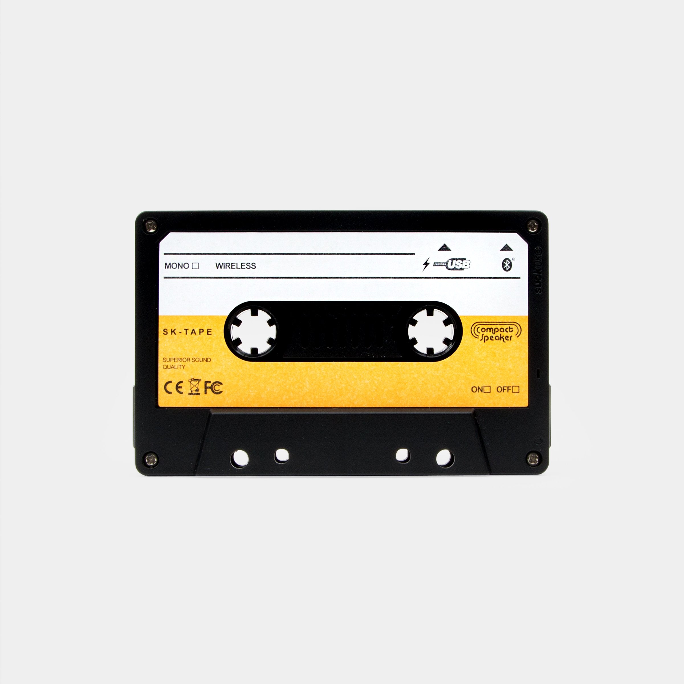Retro cassette tape Bluetooth speaker front view on grey background