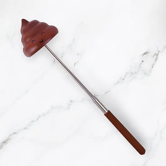 Telescopic novelty poop stick on white background