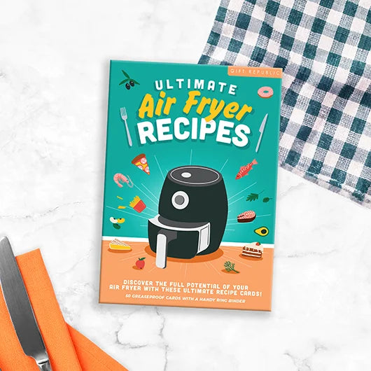 Ultimate Air Fryer Recipe Cards booklet beside utensils on worktop