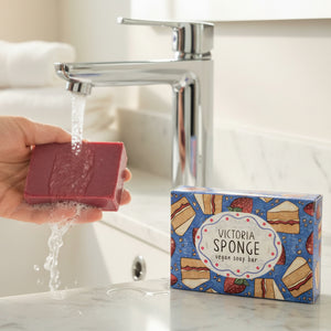 Victoria sponge soap bar being used to wash hands at sink.