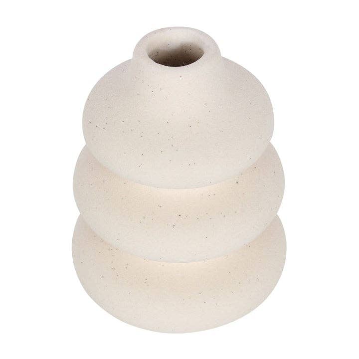 Cream wavy vase from side showing sculptural stacked design