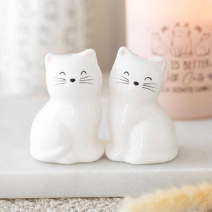 Pair of white ceramic cat salt and pepper shakers with happy faces