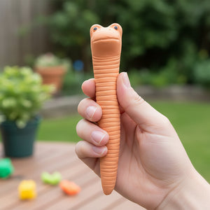 Willy the Worm terracotta water sensor held in hand showing friendly face