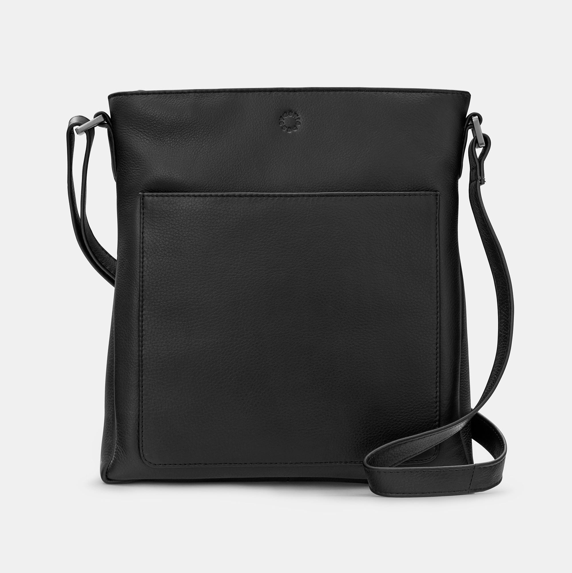 Black leather Bryant bag front view with adjustable strap on grey background