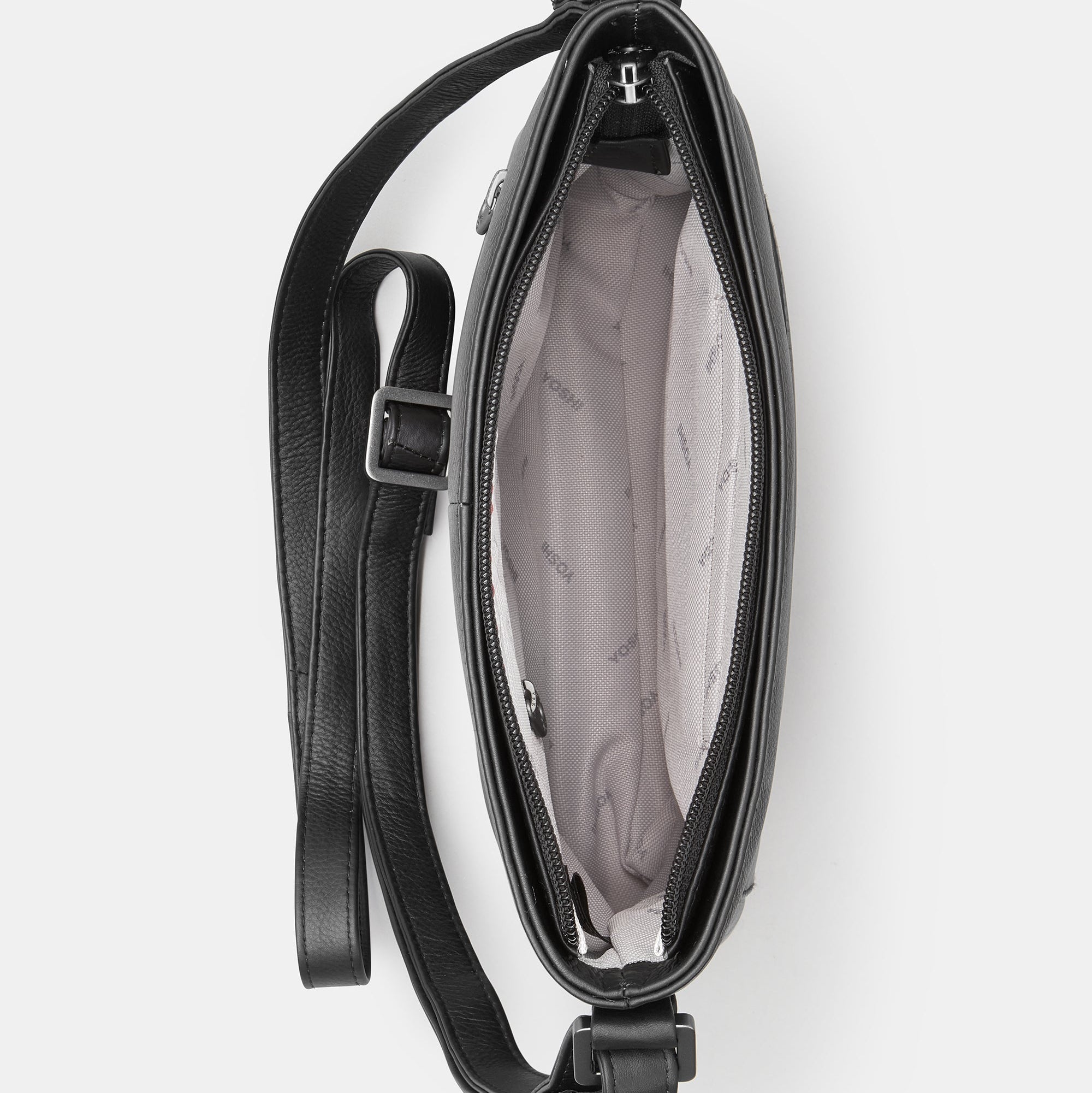 Black leather crossbody bag overhead view showing grey patterned lining interior