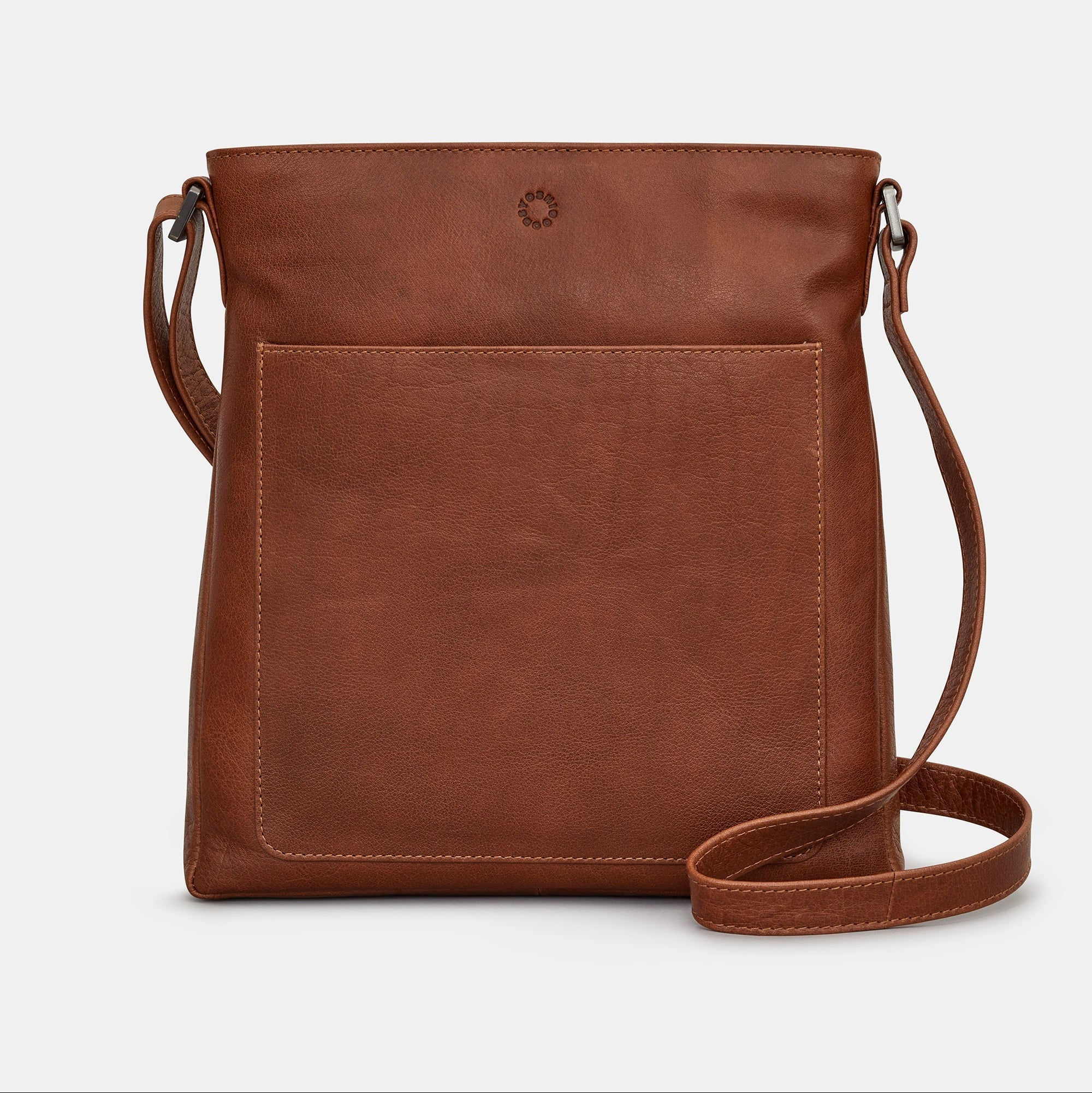 Brown leather Bryant bag front view with adjustable strap on grey background