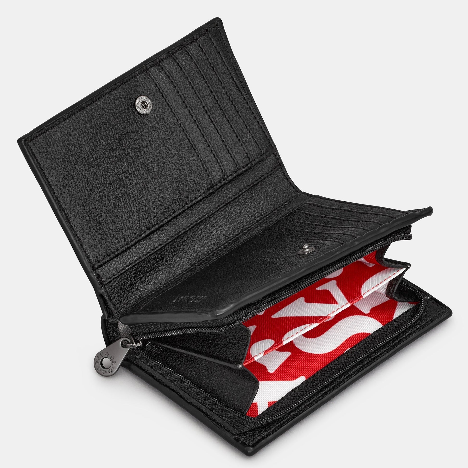 Dracula book purse open interior showing card slots and red lining on white background