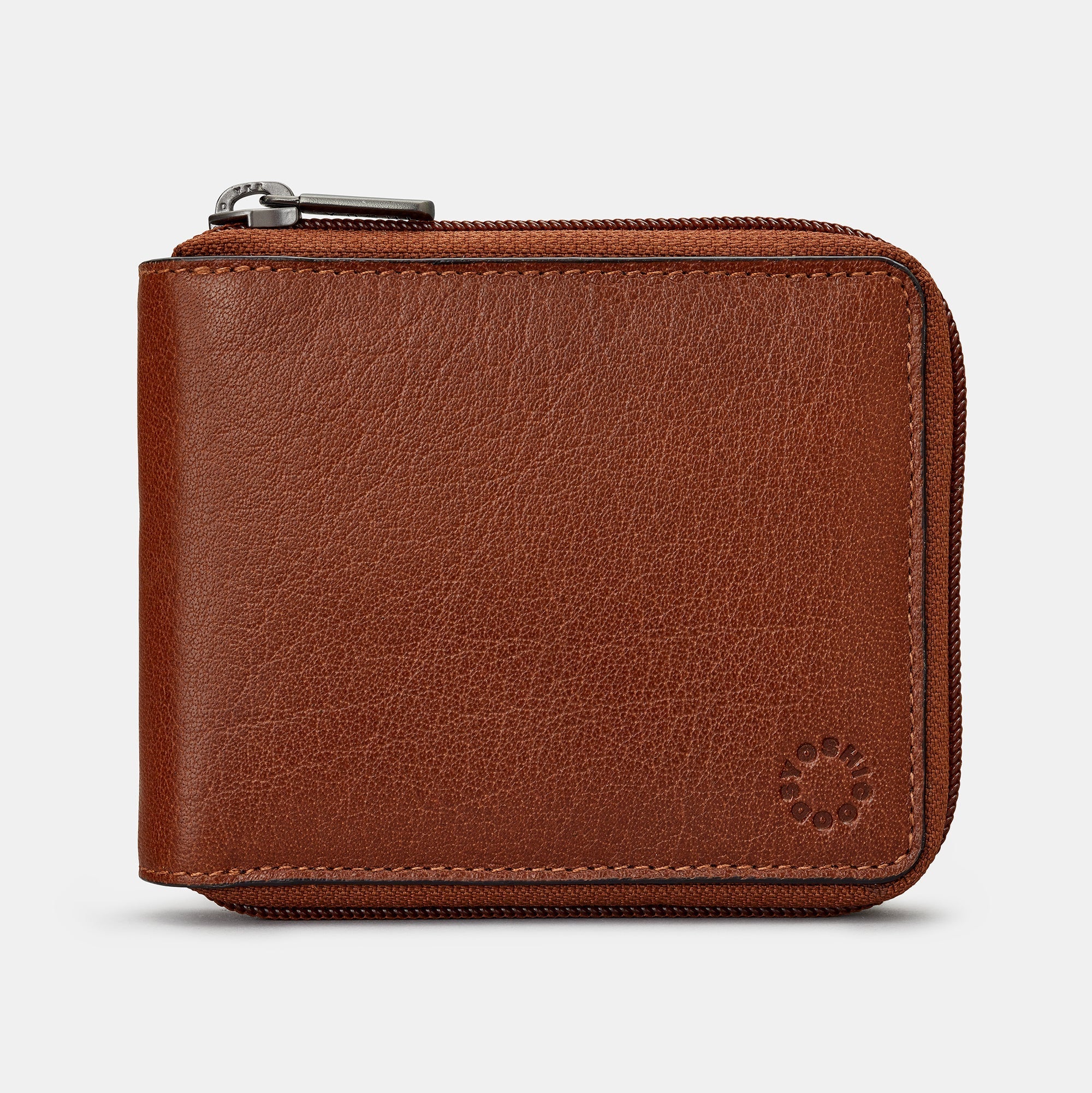 Yoshi zip round wallet in brown leather angled view