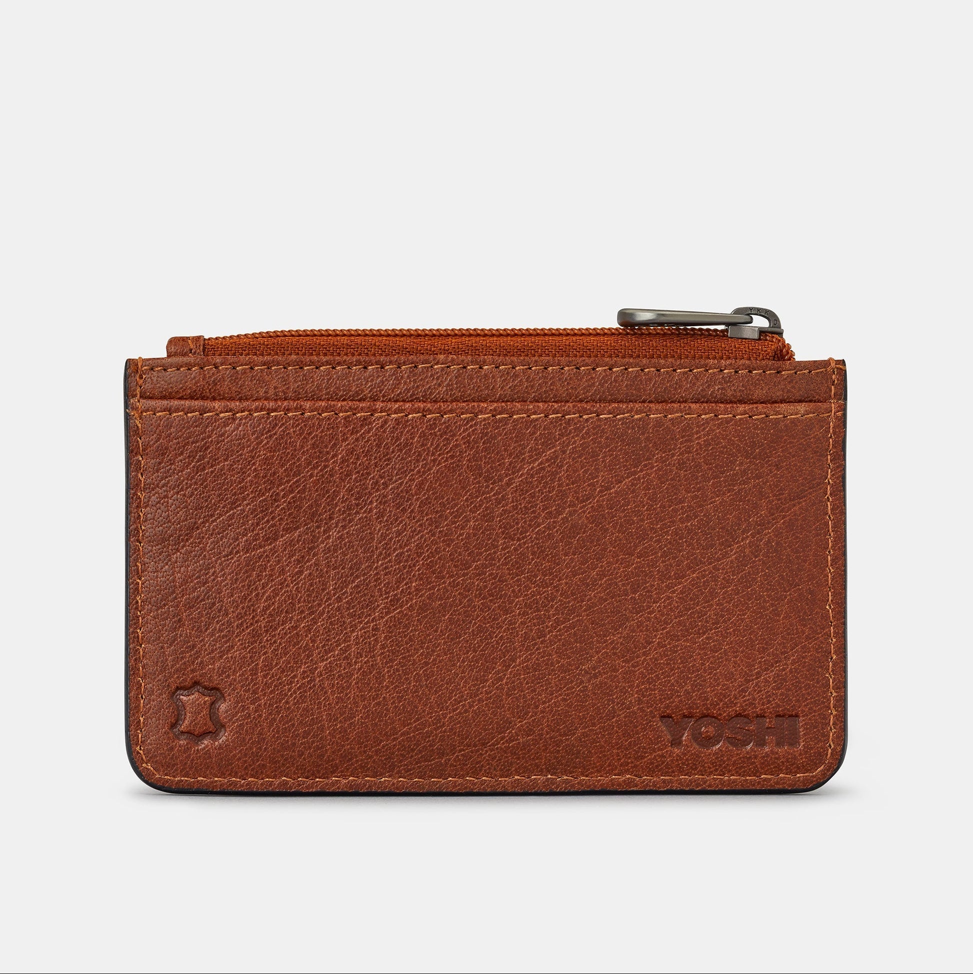 Brown leather card holder back view showing Yoshi logo on grey background