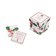 A box of family friendly trivia questions and charades to play around the diner table. The box is open with a couple of cards as an example. 